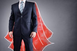 Salesman wearing superhero cape.