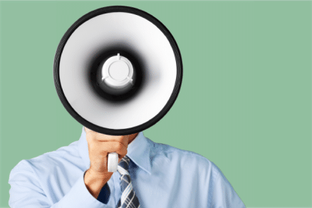 A salesperson using a megaphone to broadcast a message.